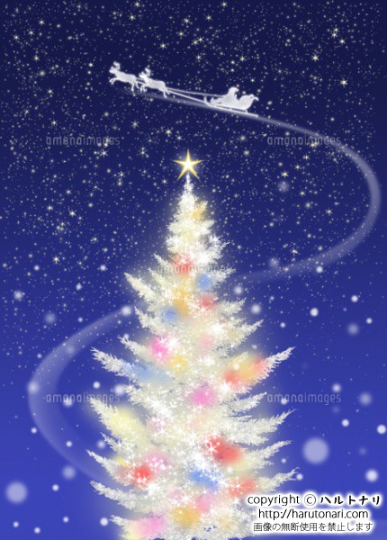 色々な色に光る白いクリスマスツリーとソリに乗るサンタクロース