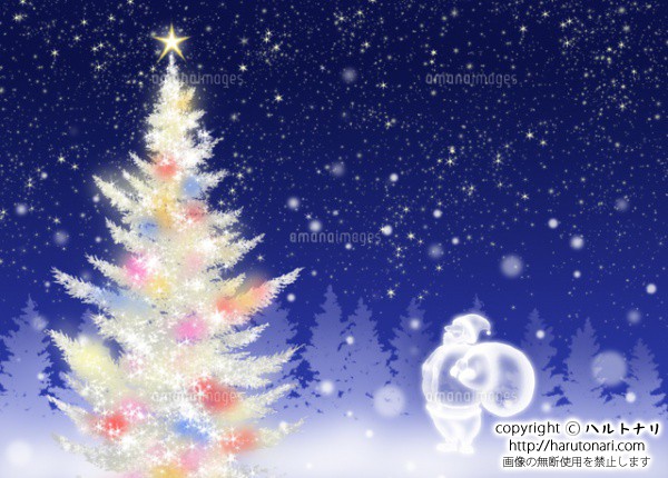 色々な色に光る白いクリスマスツリーとサンタクロース